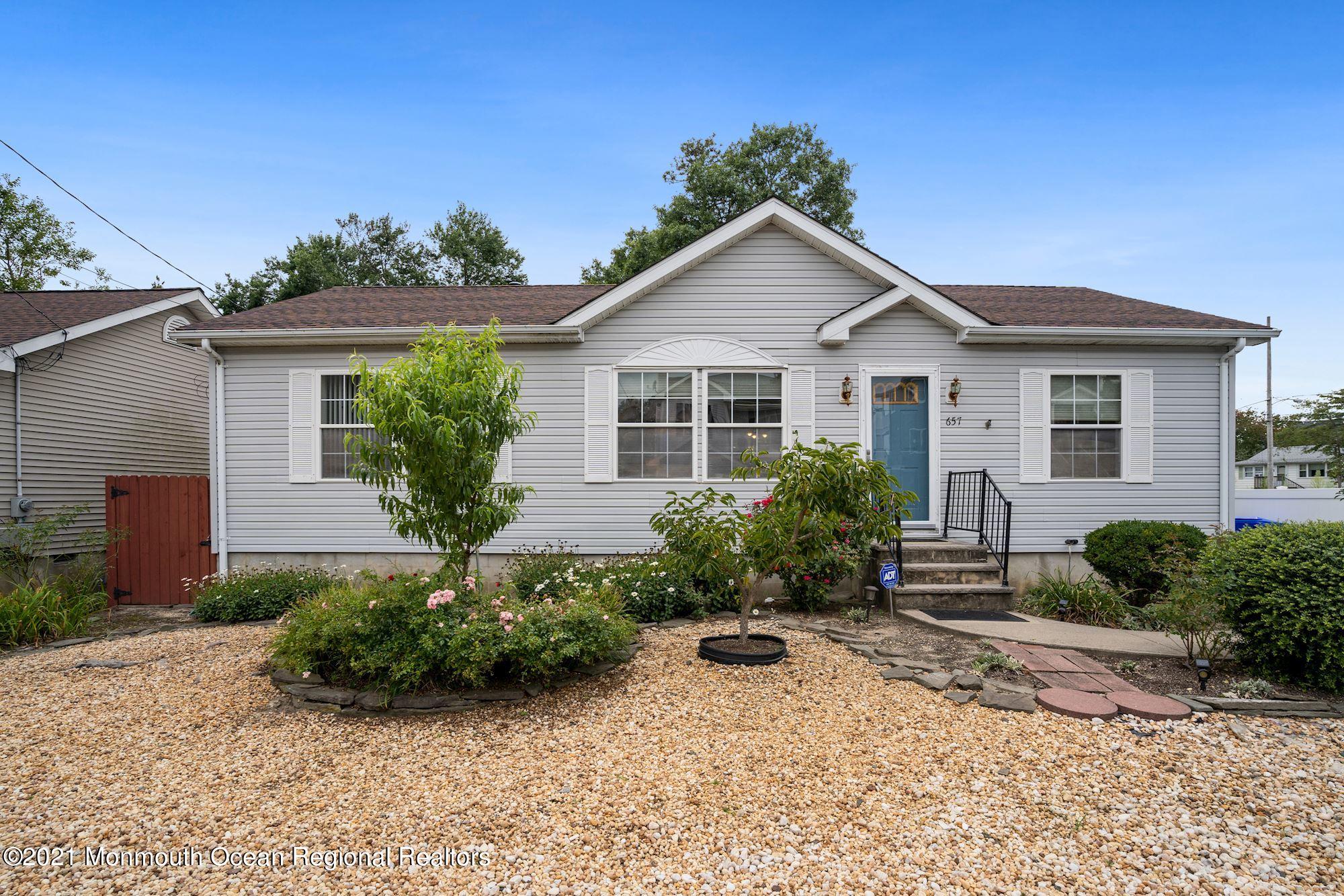 657 Drum Point Road Brick, NJ 08723 - Photo 22 of 25 a view of a house with a yard
