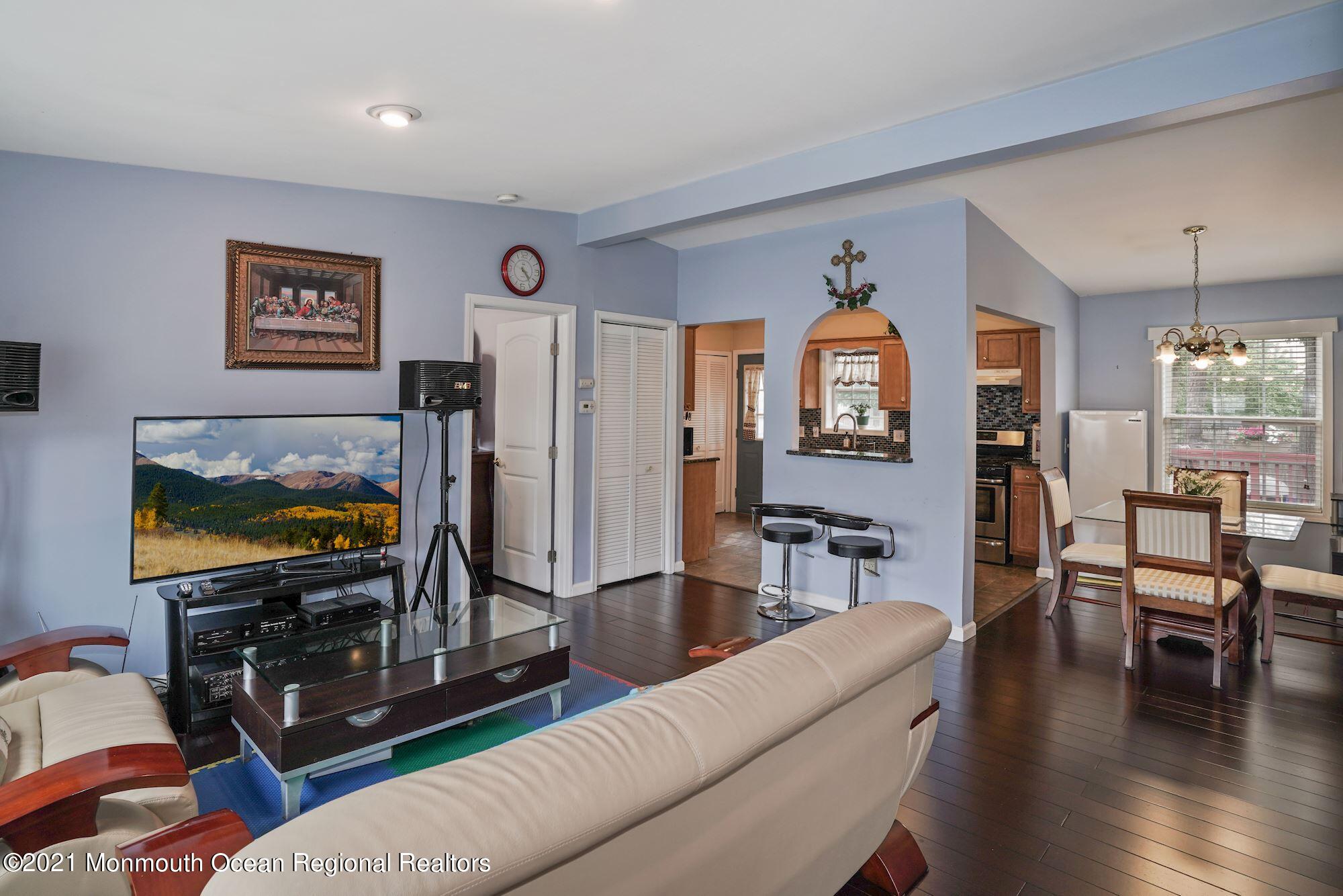 657 Drum Point Road Brick, NJ 08723 - Photo 6 of 25 a living room with furniture and a flat screen tv