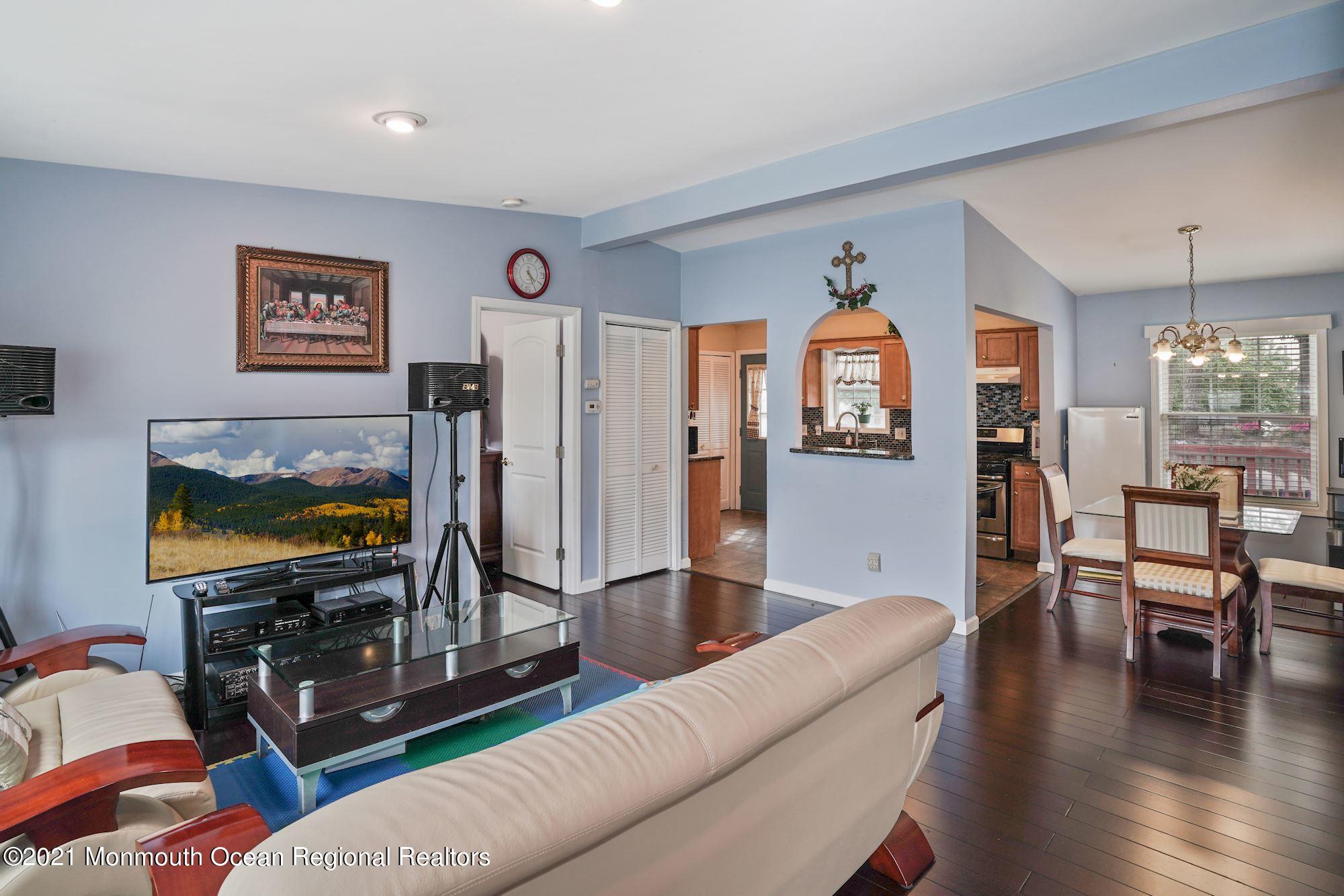 657 Drum Point Road Brick, NJ 08723 - Photo 7 of 25 a living room with furniture and a flat screen tv