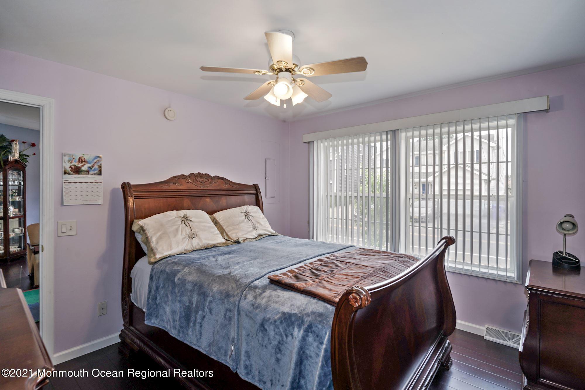 657 Drum Point Road Brick, NJ 08723 - Photo 9 of 25 a bedroom with a bed and a window