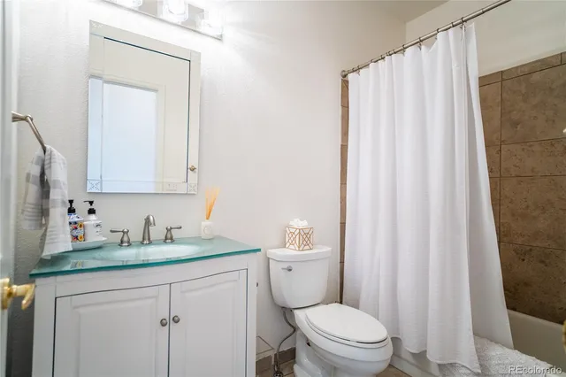 a kitchen with a sink cabinets and window
