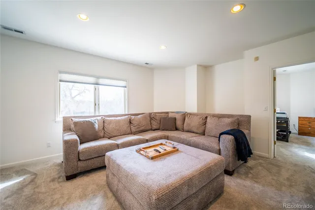 a living room with furniture and a couch