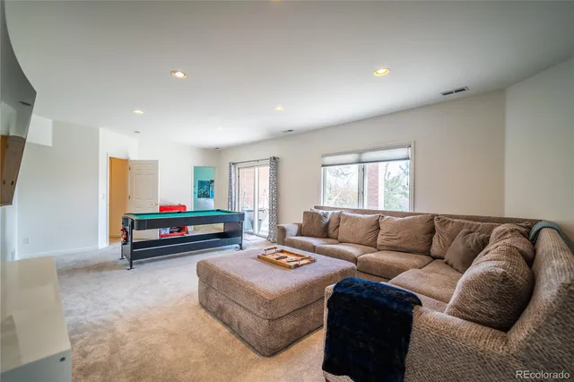 a front view of a house with a yard and balcony
