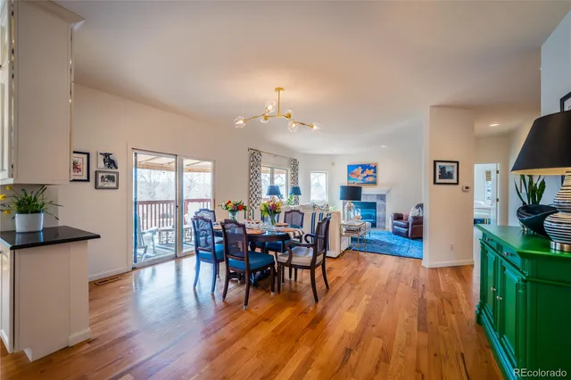 a view of a livingroom with furniture window and wooden floor