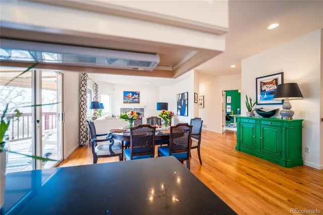 a living room with furniture and a kitchen view