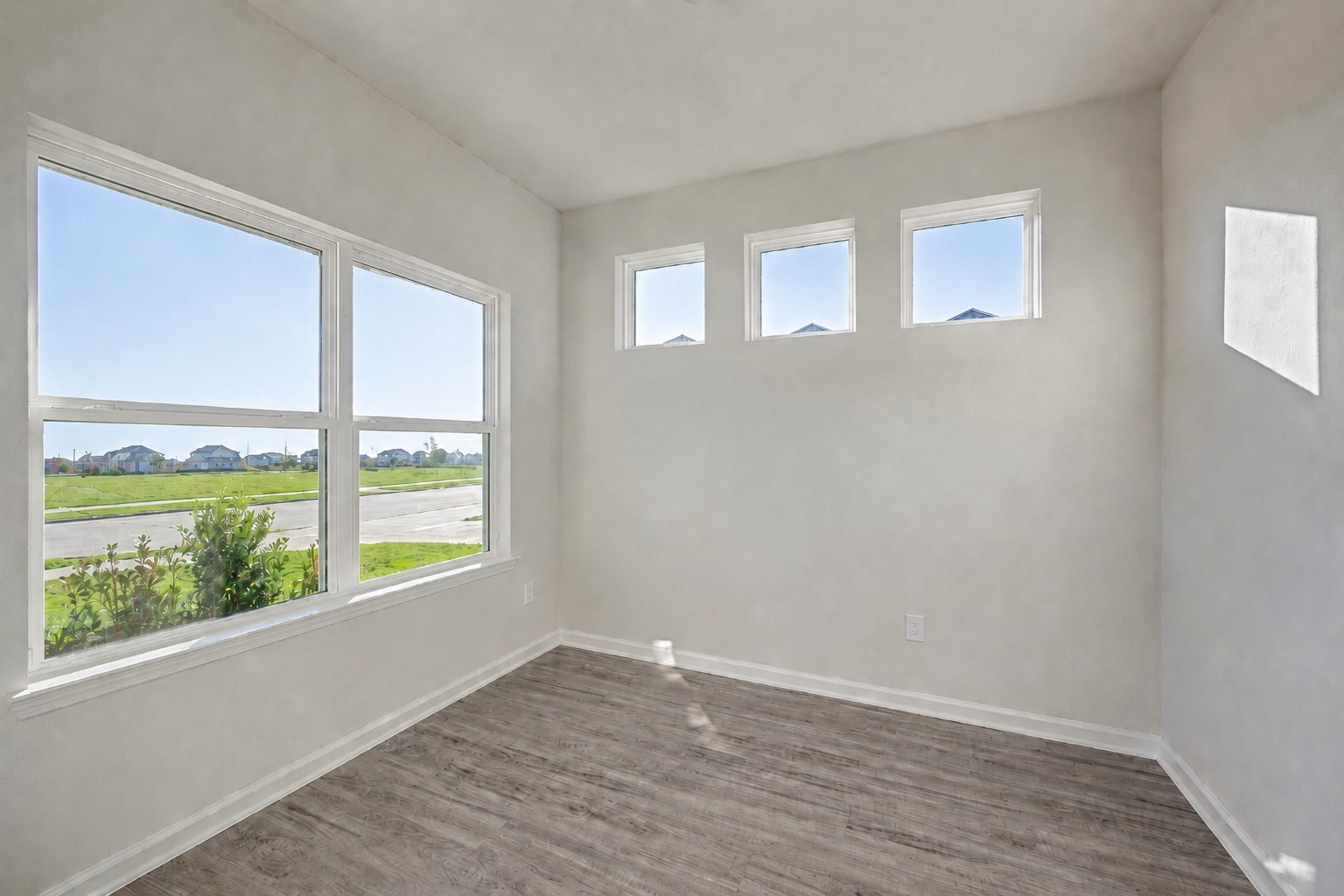 1929 North Riverside Circle Dayton, TX 77535 - Photo 3 of 21 Office-A bright and versatile flex space featuring abundant windows, durable flooring, and plenty of natural light—ideal for a home office, study, or sitting room.