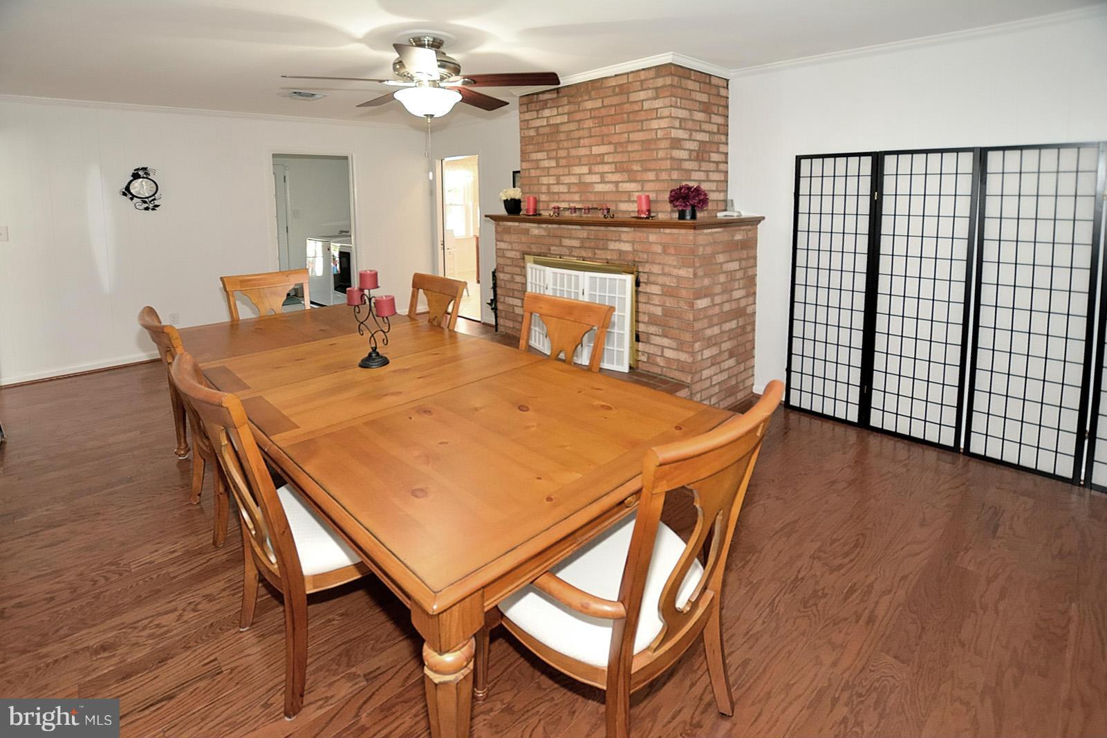 4902 Pole Road Alexandria, VA 22309 - Photo 11 of 30 a view of a dining room with furniture and a chandelier