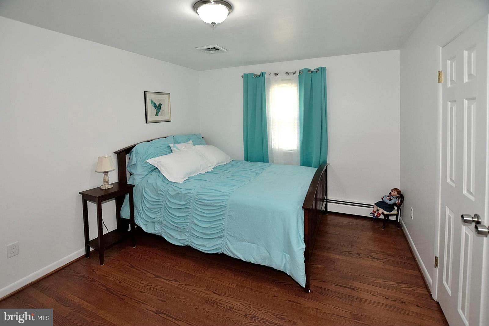 4902 Pole Road Alexandria, VA 22309 - Photo 16 of 30 a bedroom with a bed and a mirror