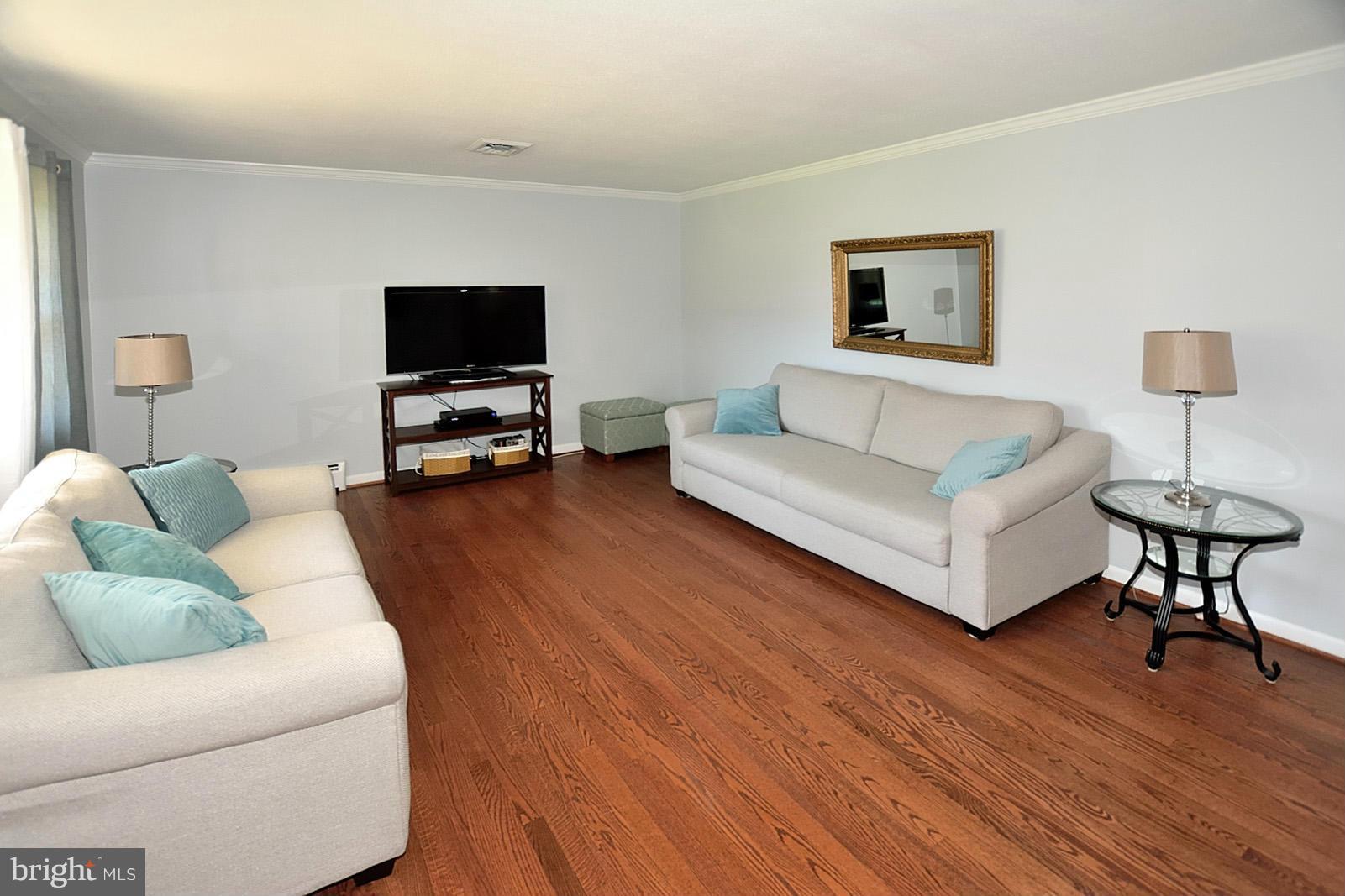 4902 Pole Road Alexandria, VA 22309 - Photo 5 of 30 a living room with furniture and a flat screen tv
