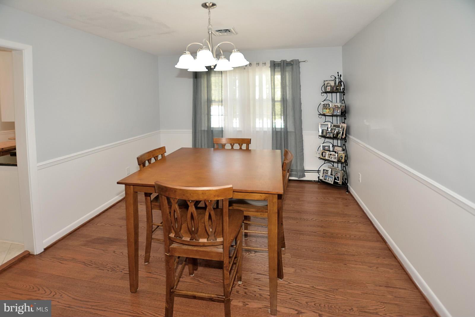 4902 Pole Road Alexandria, VA 22309 - Photo 6 of 30 a view of a dining room with furniture and wooden floor