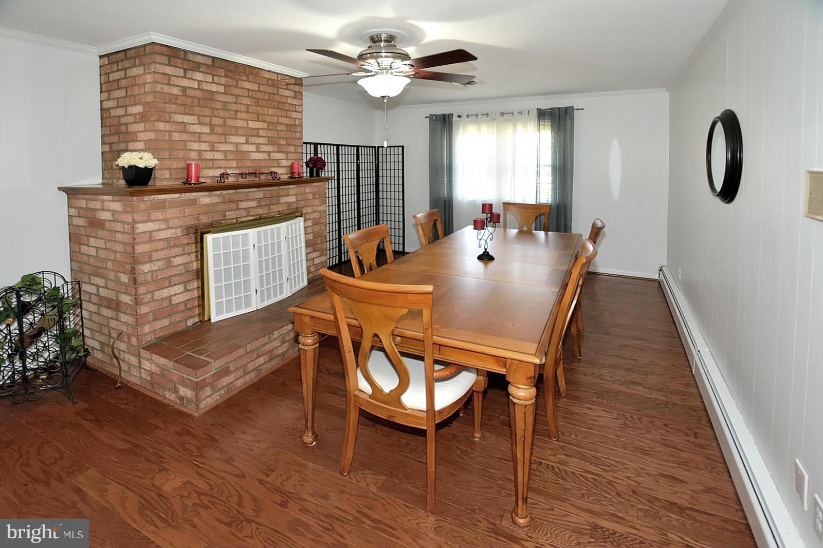 4902 Pole Road Alexandria, VA 22309 - Photo 10 of 30 a view of a dining room with furniture window and wooden floor