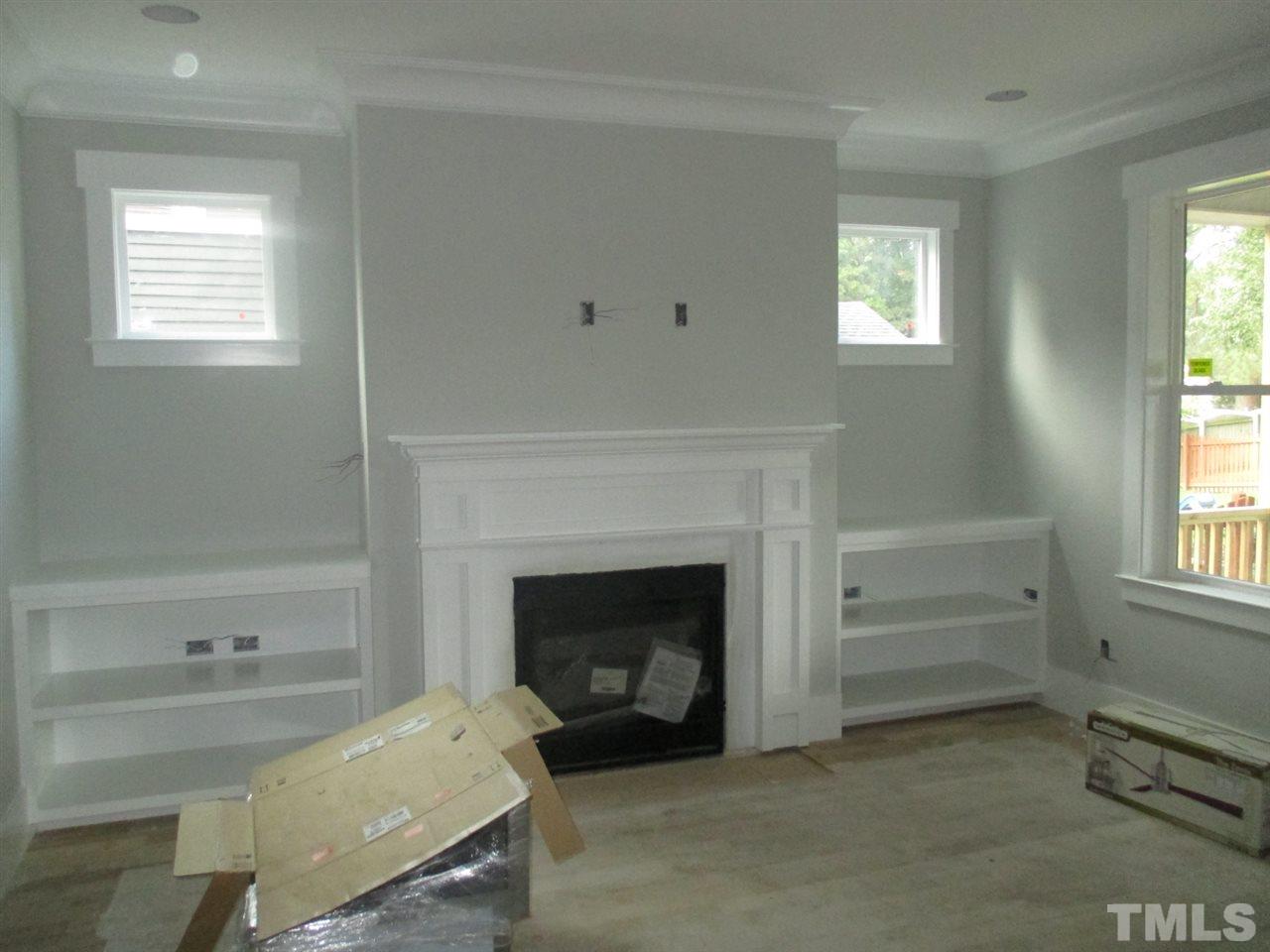 1104 Watauga Street Raleigh, NC 27604 - Photo 2 of 14 a living room with furniture and a fireplace