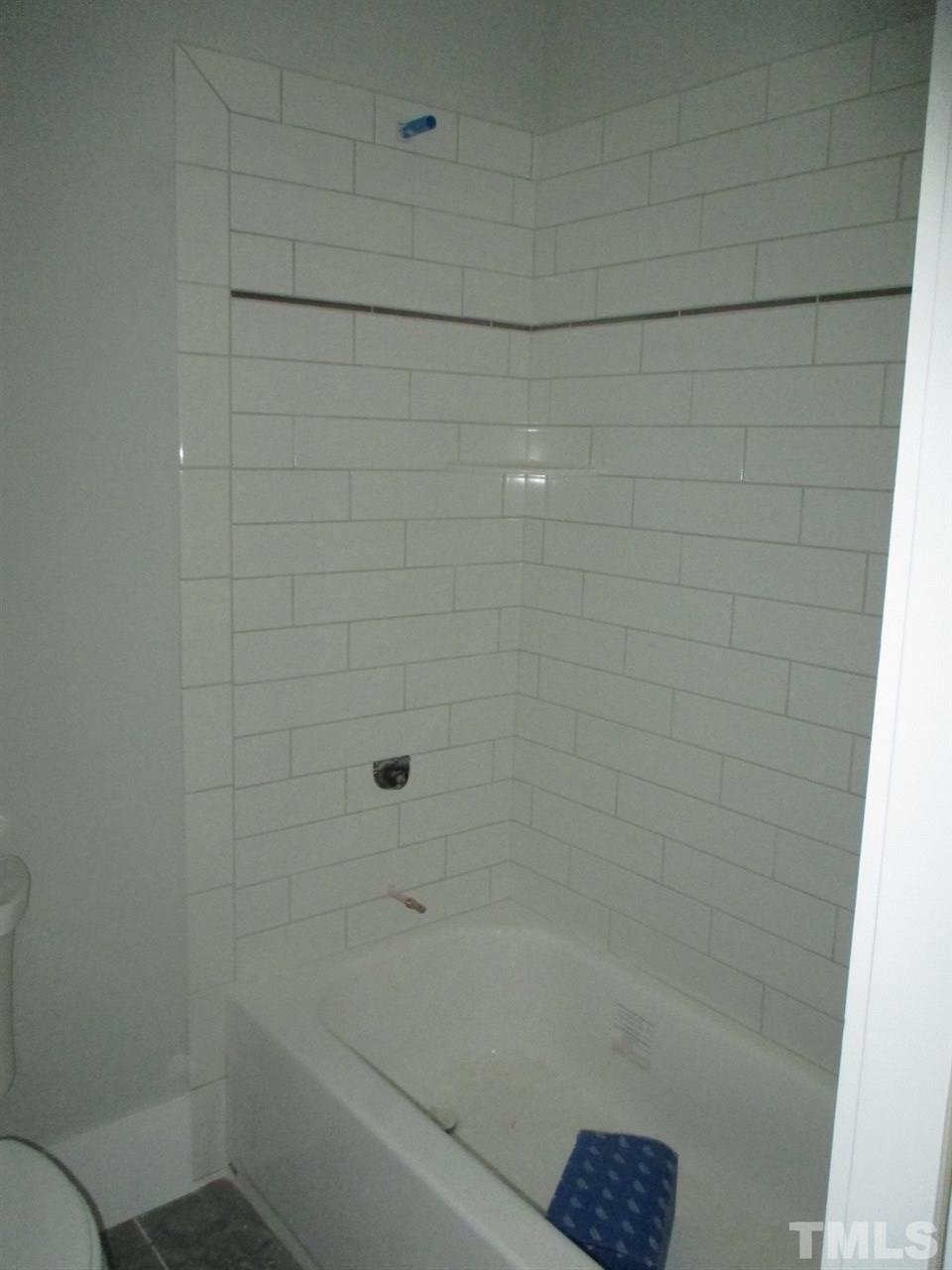 1104 Watauga Street Raleigh, NC 27604 - Photo 11 of 14 a bathroom with a bathtub