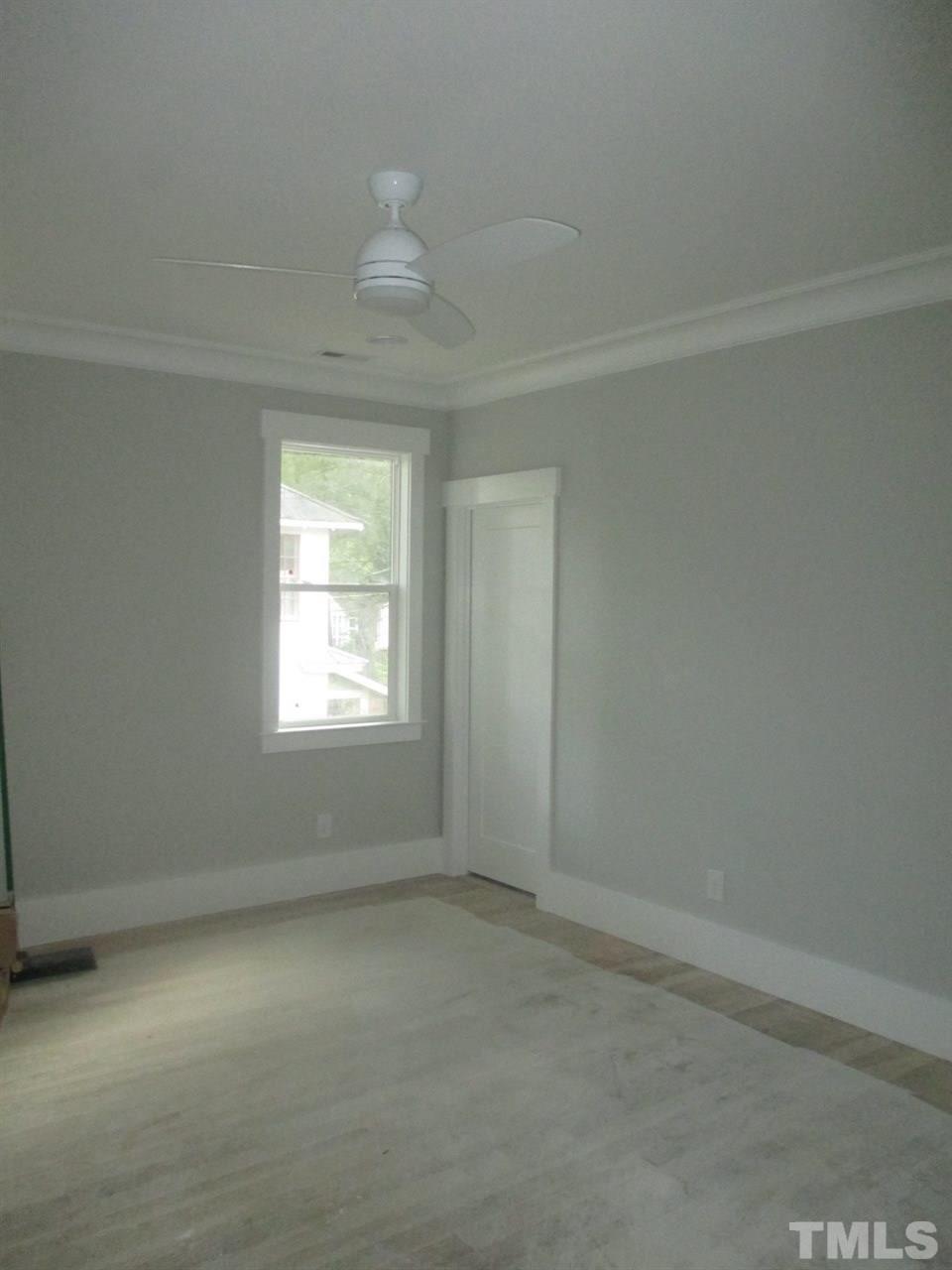1104 Watauga Street Raleigh, NC 27604 - Photo 5 of 14 an empty room with a window