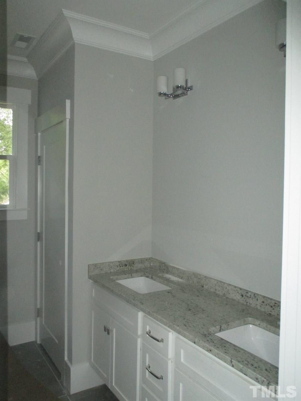 1104 Watauga Street Raleigh, NC 27604 - Photo 6 of 14 a bathroom with a granite countertop sink and vanity