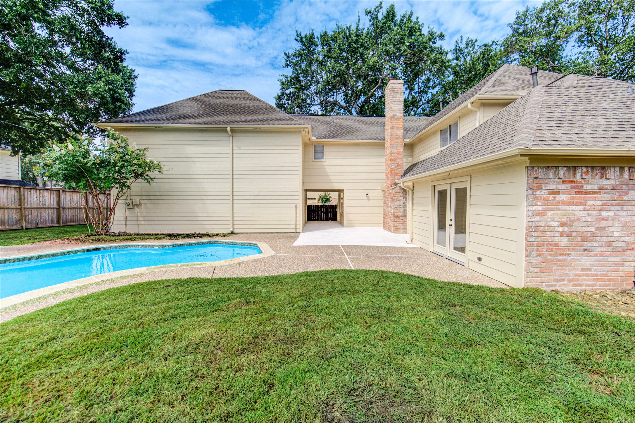 9115 Taidswood Drive Spring, TX 77379 - Photo 40 of 45 The French doors to the right lead to the primary bedroom. This makes it convenient to sit poolside with your morning cup of coffee or an evening glass of wine!
