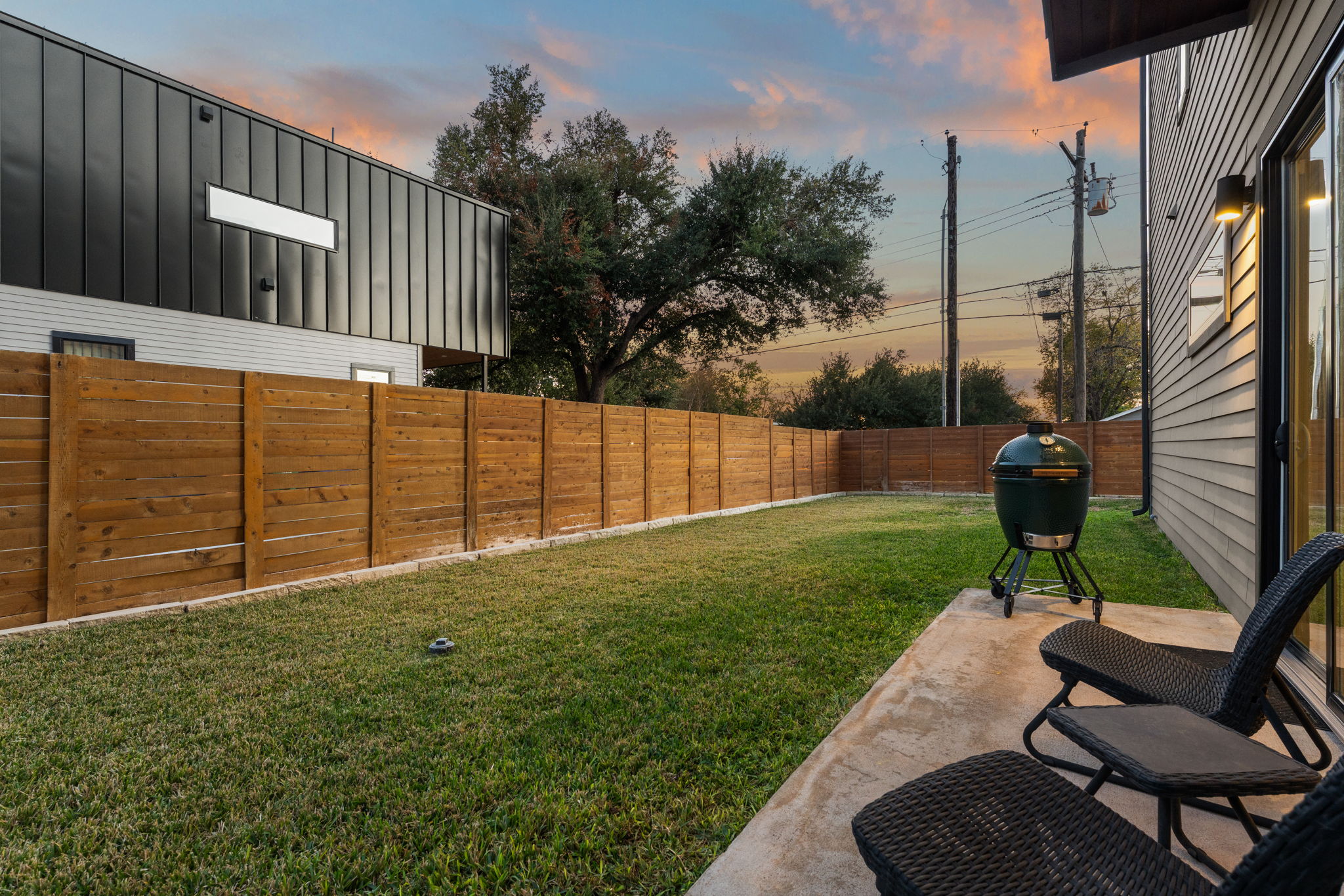 1116 Stobaugh Street, Unit A Austin, TX 78757 - Photo 31 of 37 a view of a backyard with sitting area