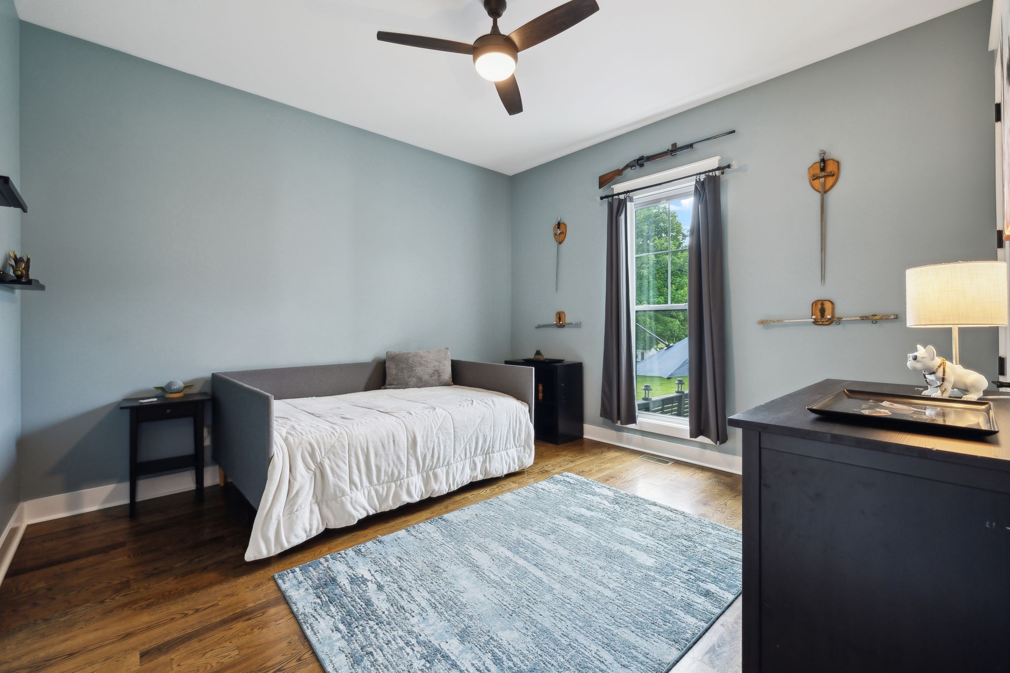 273 Halltown Road Cottontown, TN 37048 - Photo 26 of 65 a bedroom with a bed and wooden floor