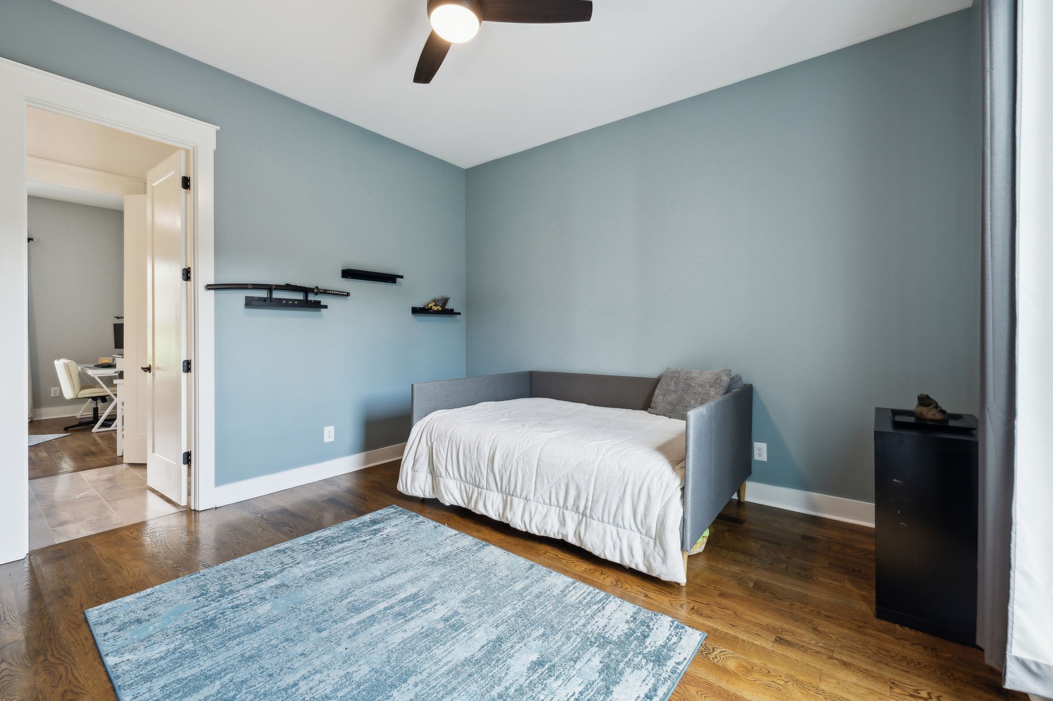 273 Halltown Road Cottontown, TN 37048 - Photo 27 of 65 a bedroom with a bed and wooden floor