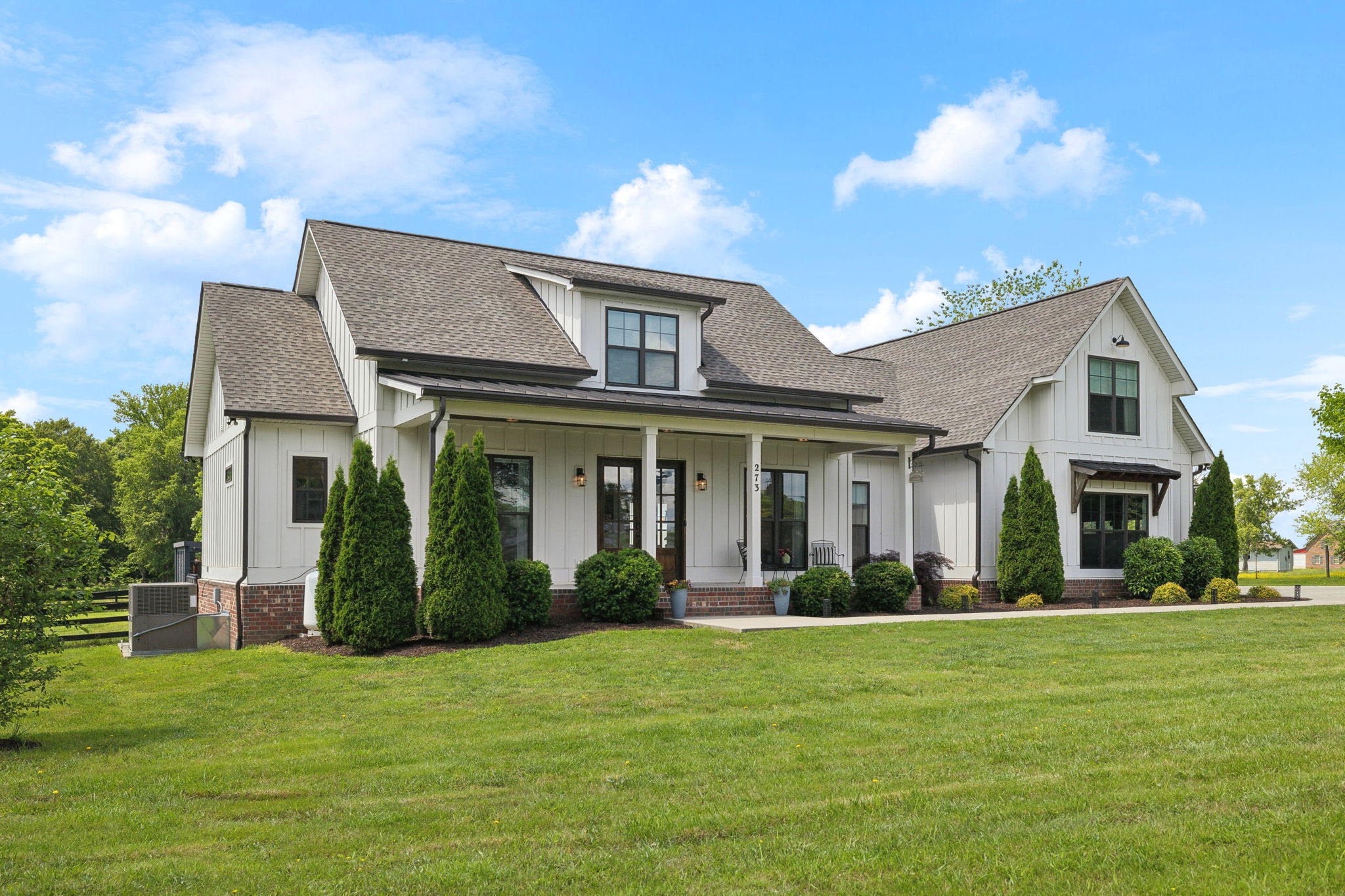 273 Halltown Road Cottontown, TN 37048 - Photo 3 of 65 a front view of a house with a garden