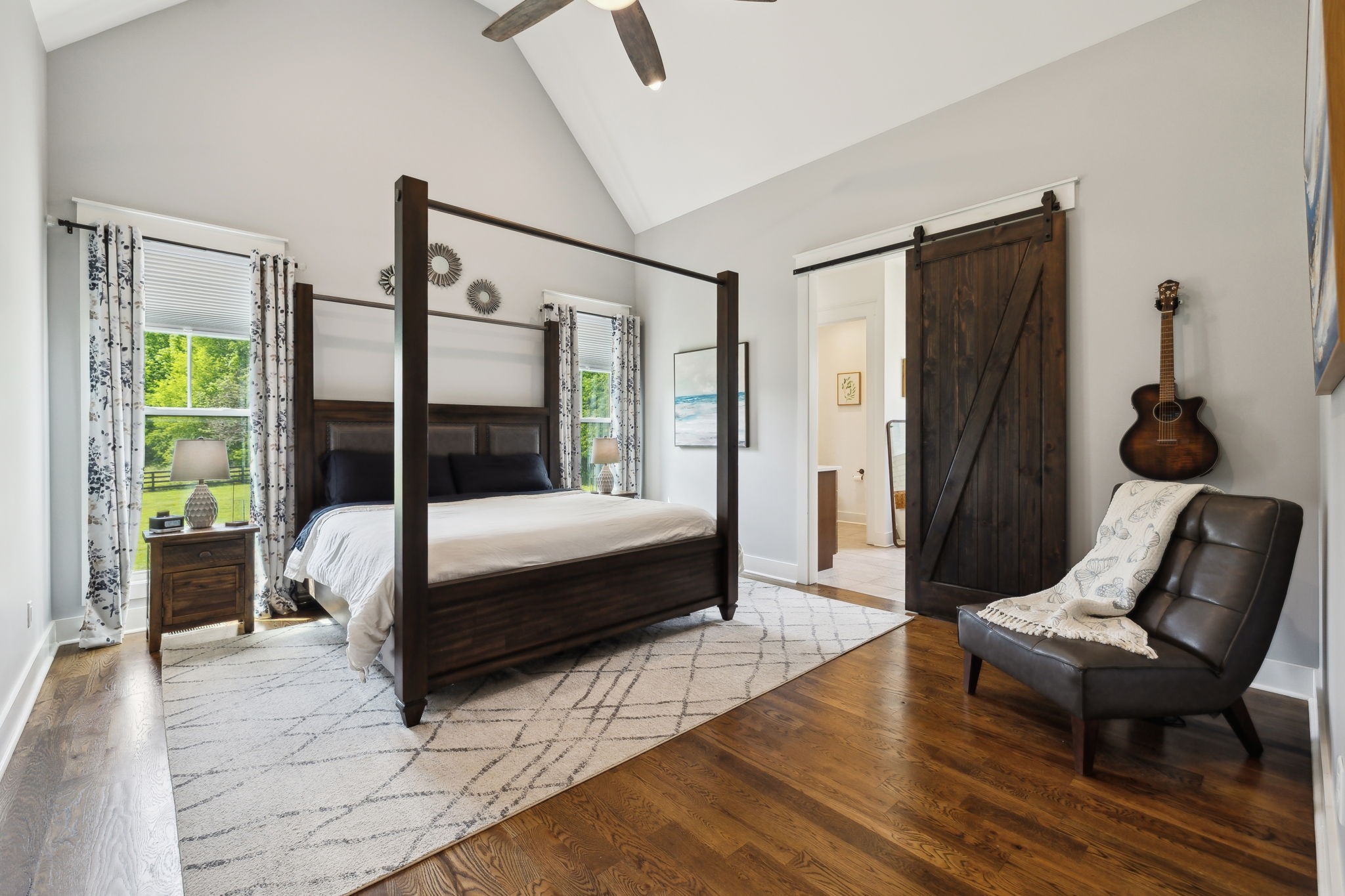 273 Halltown Road Cottontown, TN 37048 - Photo 32 of 65 a bedroom with a bed wooden floor and window