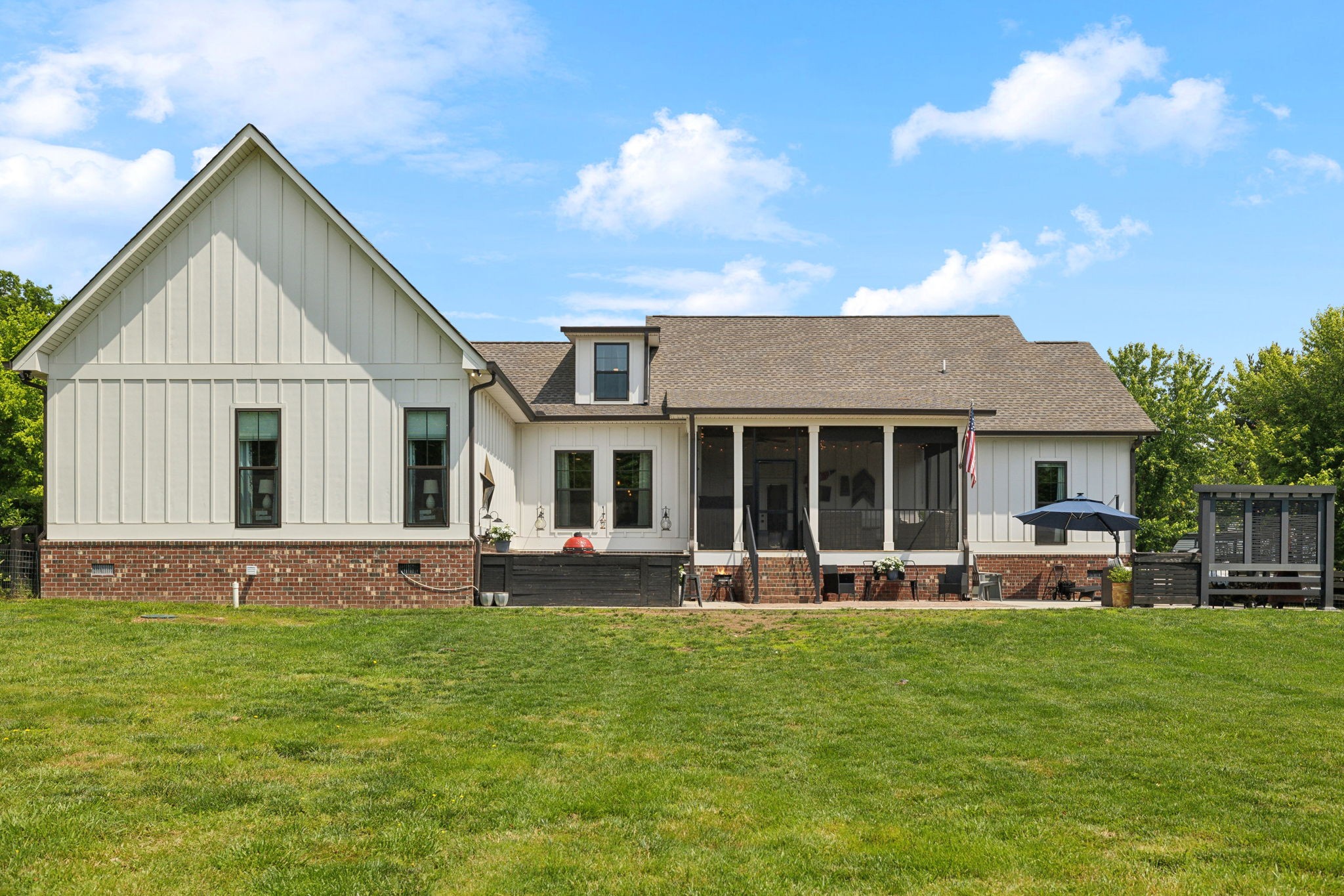 273 Halltown Road Cottontown, TN 37048 - Photo 55 of 65 a front view of a house with a yard table and chairs