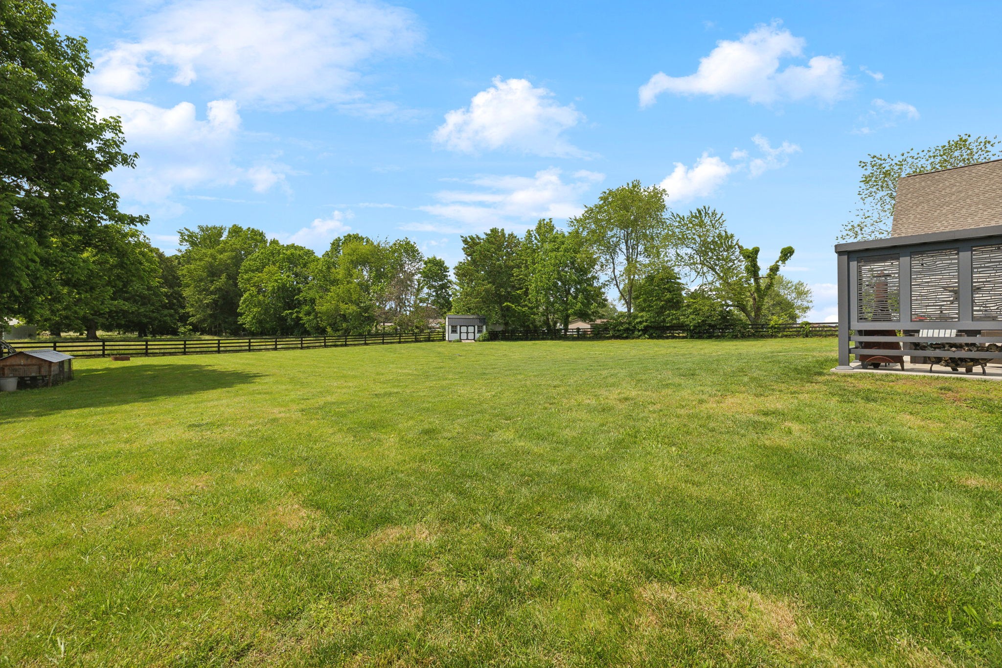 273 Halltown Road Cottontown, TN 37048 - Photo 56 of 65 a view of a green field with house in the background
