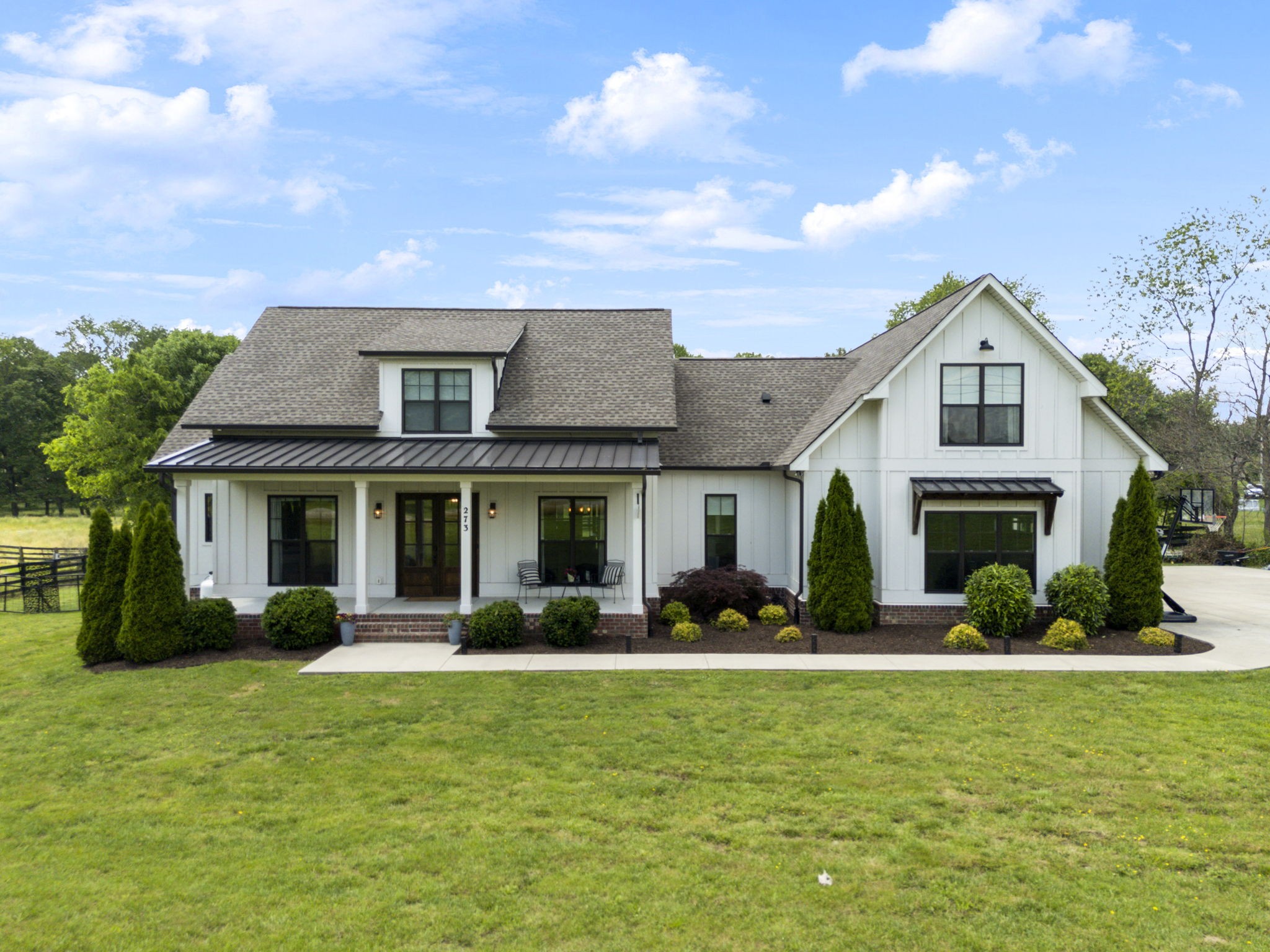 273 Halltown Road Cottontown, TN 37048 - Photo 58 of 65 a front view of a house with garden