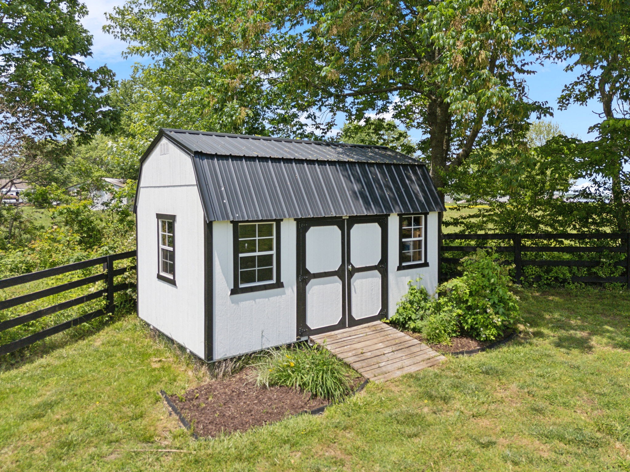 273 Halltown Road Cottontown, TN 37048 - Photo 62 of 65 a view of a house with a yard and wooden fence
