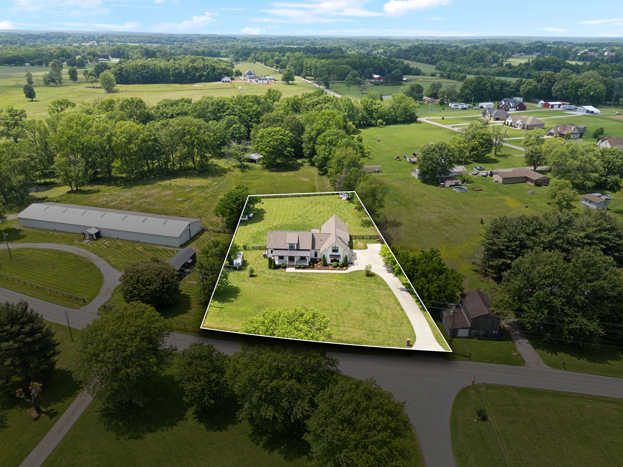 273 Halltown Road Cottontown, TN 37048 - Photo 64 of 65 an aerial view of a house with a garden and lake view