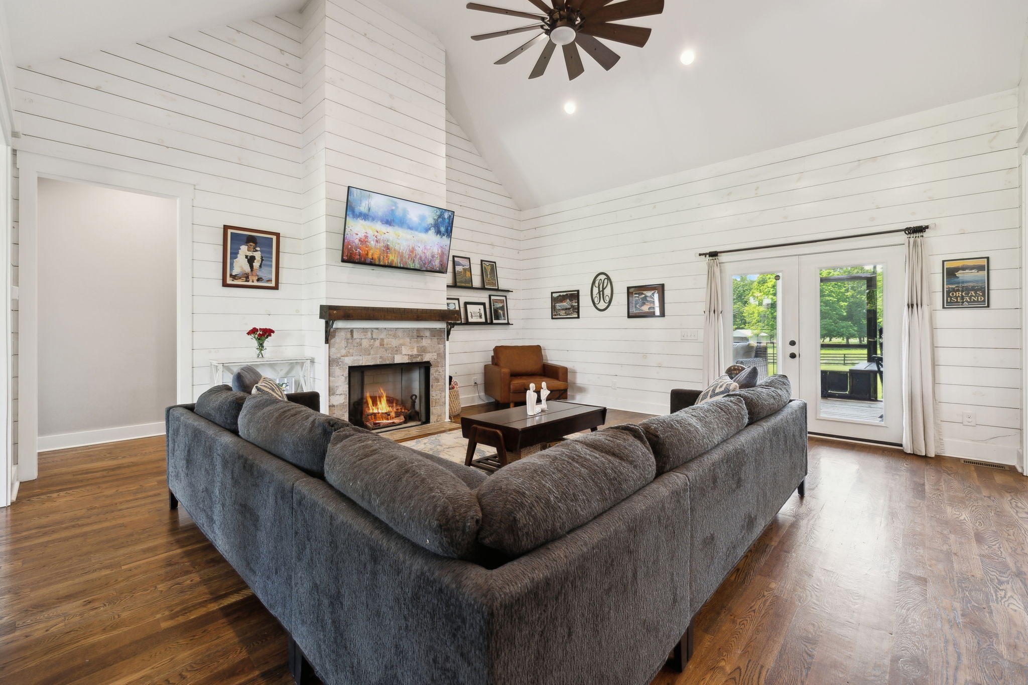 273 Halltown Road Cottontown, TN 37048 - Photo 8 of 65 a living room with furniture a flat screen tv and a fireplace
