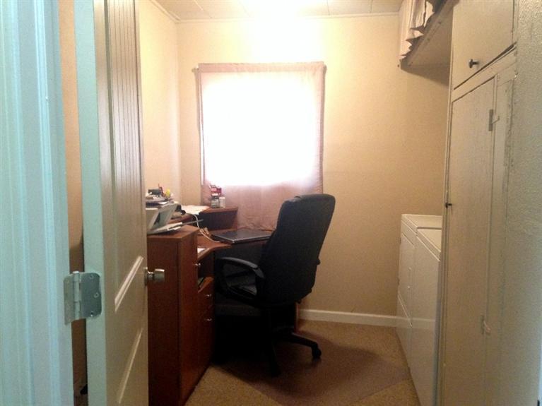 935 Three Pines Road Grants Pass, OR 97526 - Photo 11 of 26 Laundry room and desk area