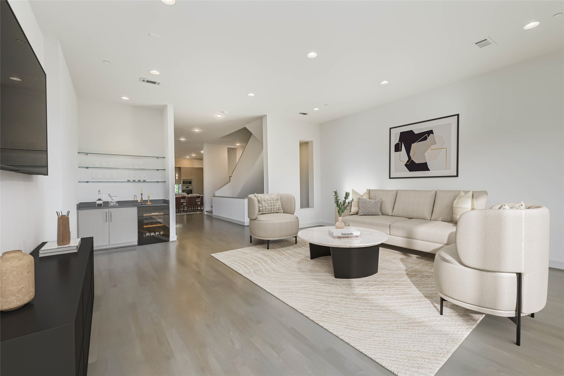 a living room with furniture and a flat screen tv