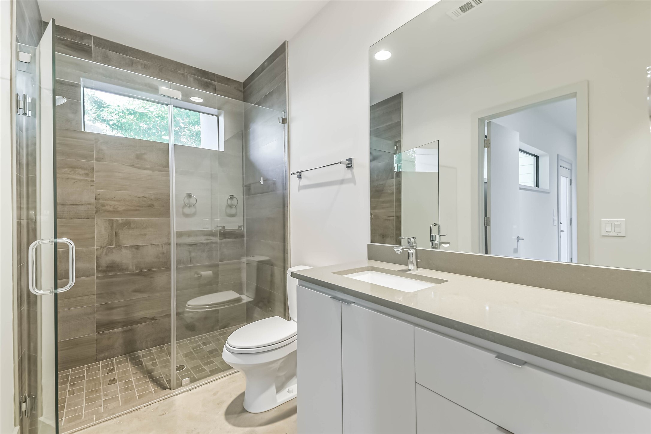 1509 Ruth Street Houston, TX 77004 - Photo 24 of 33 a bathroom with a granite countertop sink toilet and shower