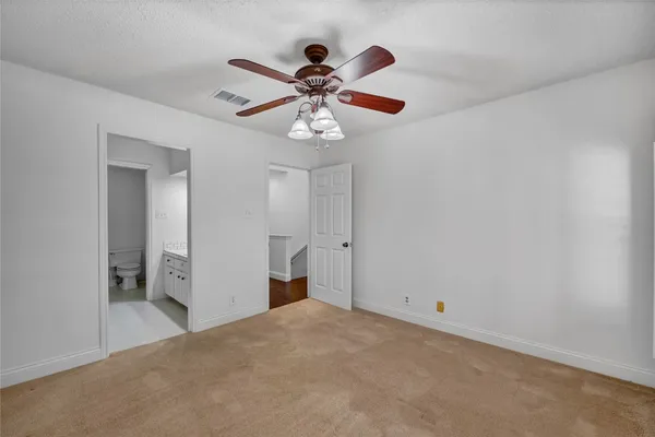 a view of a chandelier fan and a chandelier fan in a room