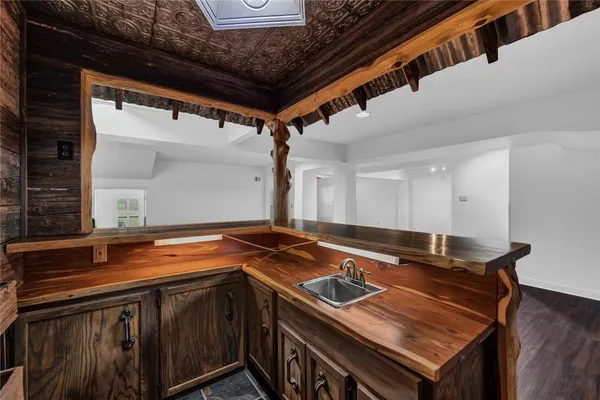 a kitchen that has a sink and a stove