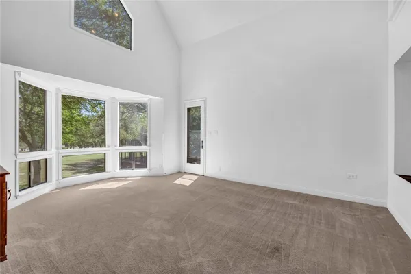 a view of an empty room with a balcony