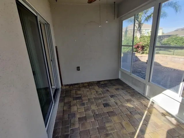 a view of an empty room and staircase