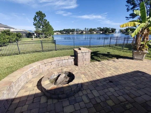 a view of a backyard with sitting area