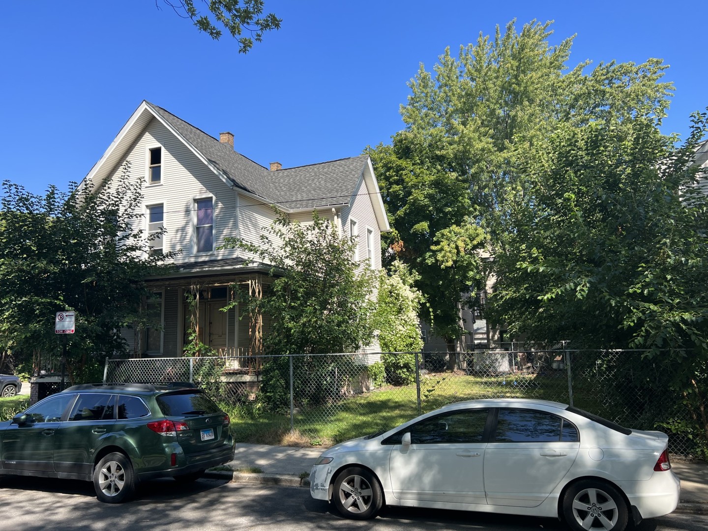 1756 West Henderson Street Chicago, IL 60657 - Photo 1 of 2 a car parked in front of a house
