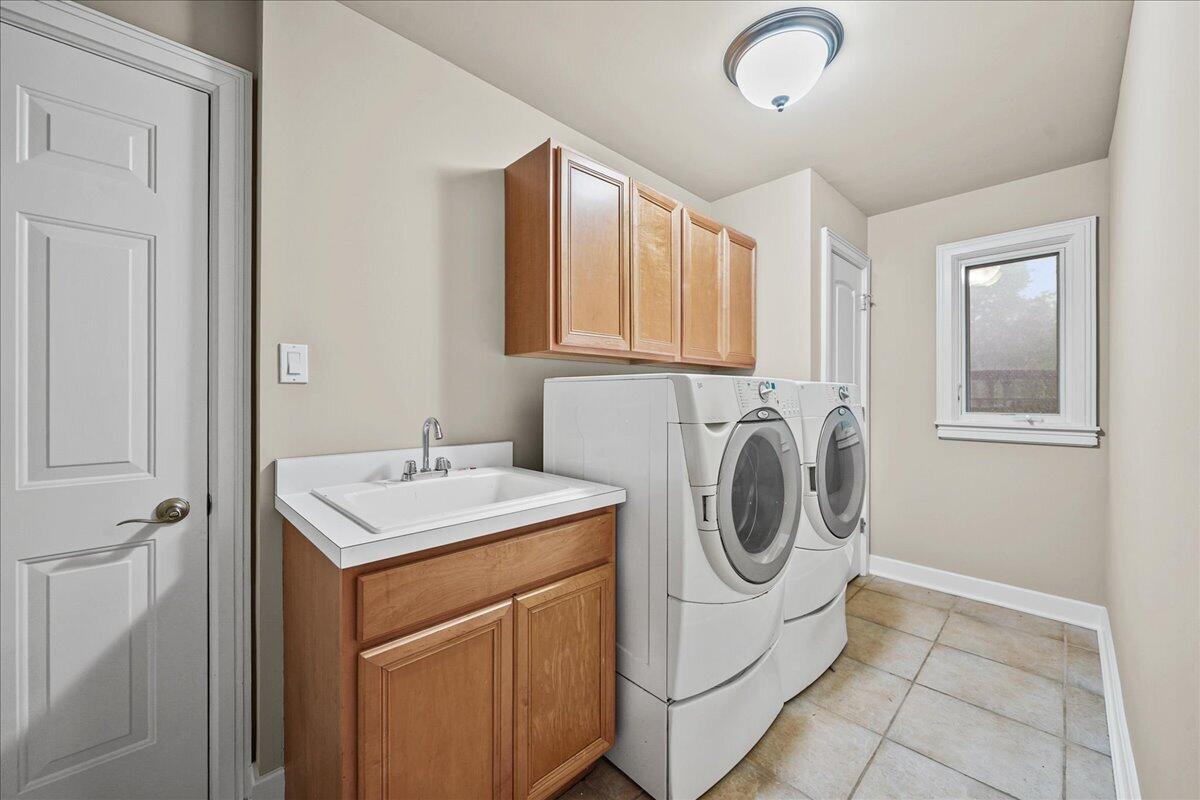 8751 Bridgewater Court Crown Point, IN 46307 - Photo 29 of 49 a utility room with sink dryer and washer