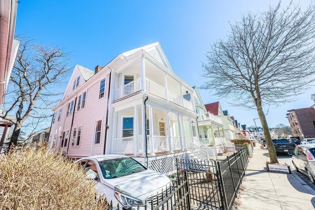 a kitchen with a sink and a stove next to a window