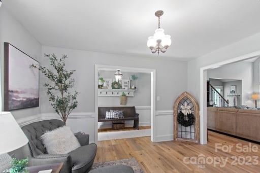 1912 Ruben Road Monroe, NC 28112 - Photo 6 of 45 a view of a livingroom with furniture a chandelier and wooden floor