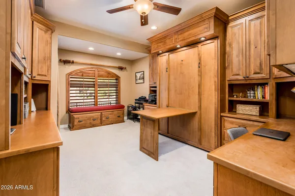 a living room with furniture and kitchen view