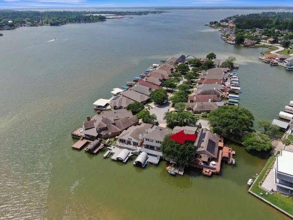an aerial view of a house with a lake view