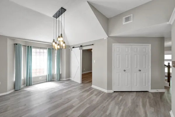 a view of livingroom with hardwood floor and ceiling fan