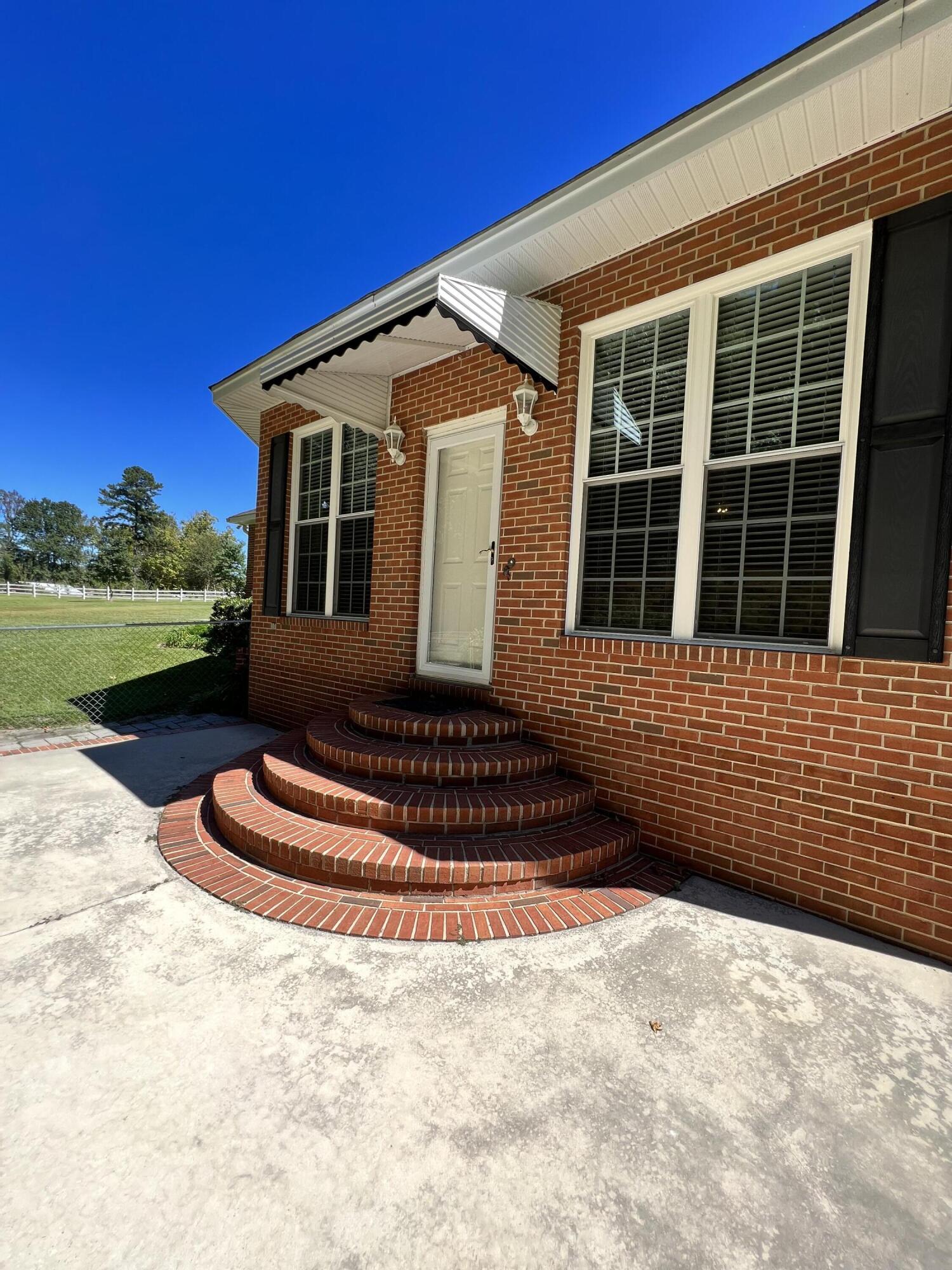 1443 Old Salem Road Thomson, GA 30824 - Photo 34 of 46 Steps to patio with awning