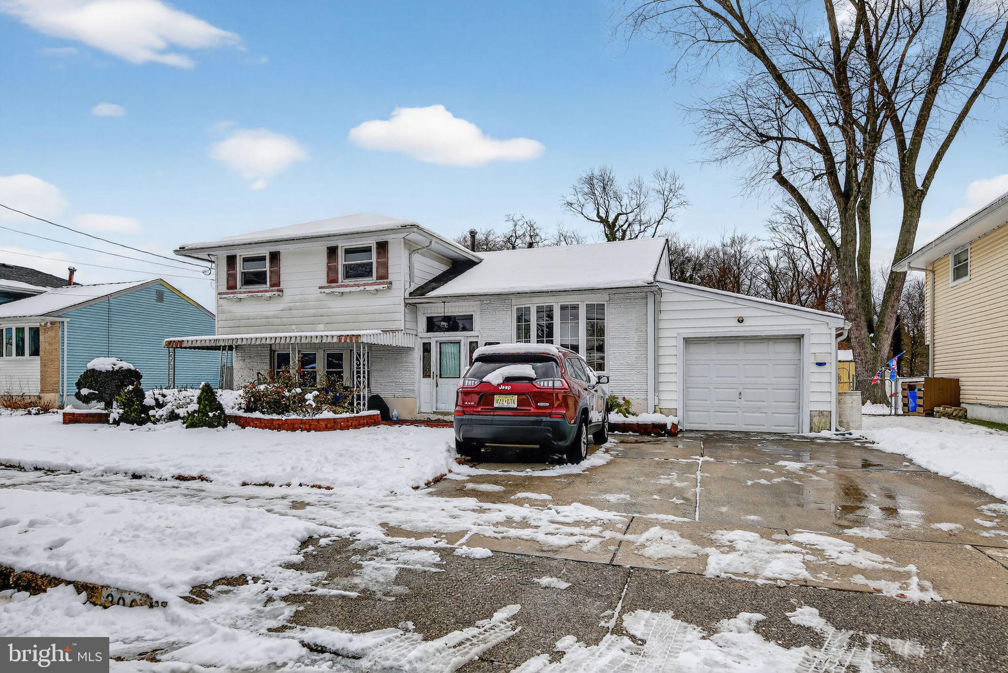 a view of a car in front of a house
