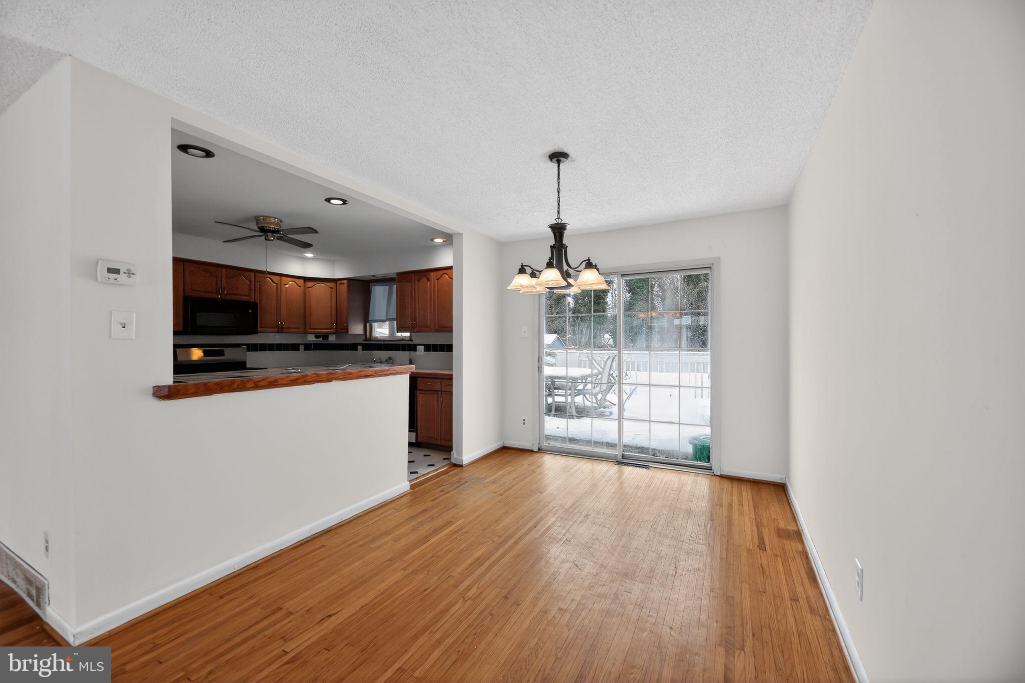 308 Smith Lane Runnemede, NJ 08078 - Photo 11 of 32 a view of a kitchen with a sink and wooden floor