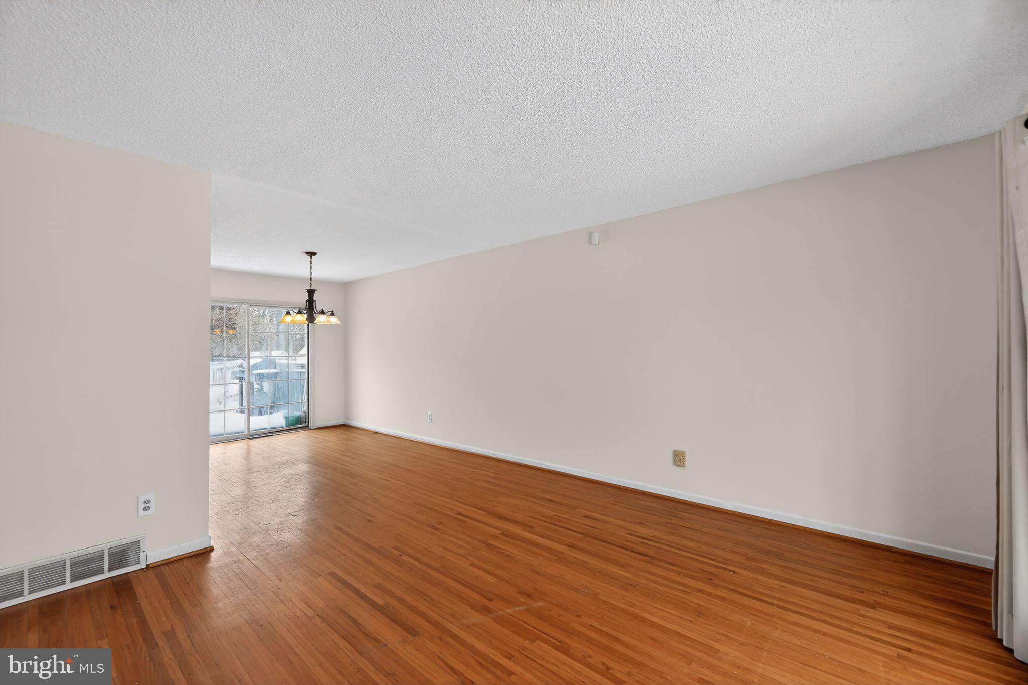 308 Smith Lane Runnemede, NJ 08078 - Photo 12 of 32 a view of an empty room with wooden floor